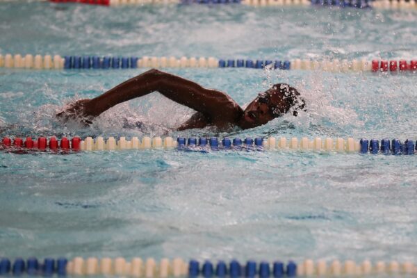 Teen Boy Swimming In Pool